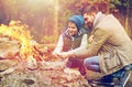 Father and son roasting marshmallow over campfire Royalty Free Stock Photo