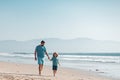 Father and son running on summer beach. Dad and child having fun outdoors. Family travel, vacation, father's day Royalty Free Stock Photo