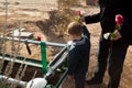 Father and Son Say Goodbye to a Loved One By Throwing Roses on a