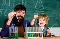 Father and son at school. Back to school. researcher carrying out scientific research in lab. Laboratory test tubes and
