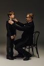 Father and son share a stylish Royalty Free Stock Photo