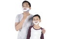 Father and son with shaving foam Royalty Free Stock Photo