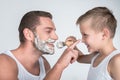 Father and son shaving together Royalty Free Stock Photo