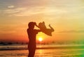 Father and son silhouettes play at the beach Royalty Free Stock Photo