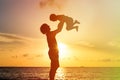 Father and son silhouettes play at sunset Royalty Free Stock Photo