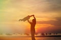 Father and son silhouettes play at sunset Royalty Free Stock Photo