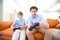 Father and son playing video game Royalty Free Stock Photo