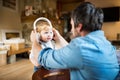 Father and son with smartphone and earphones, listening music. Royalty Free Stock Photo