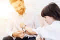 Father and son spend time together. Dad and son in the same clothes. Dad helps his son. Royalty Free Stock Photo