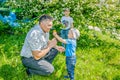 Father and son spend time on a walk in the Park in the summer on a Sunny day. Royalty Free Stock Photo