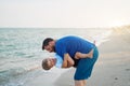 Father son spending time together sea vacation Young dad child little boy walking beach Royalty Free Stock Photo