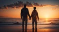 father and son standing on the sea shore holding hands at sunset fathers day Royalty Free Stock Photo