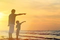 Father and son at sunset beach Royalty Free Stock Photo