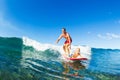 Father and Son Surfing, Riding Wave Together