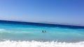 Father and son swim in the Aegean Sea