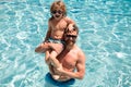 Father and son swimming in pool, summer family. Child with dad playing in swimming pool. Family in pool. Summer vacation Royalty Free Stock Photo