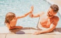 Father and son swimming in pool, summer family. Child with dad playing in swimming pool. Family time. Summer vacation Royalty Free Stock Photo