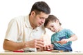 Father and son tinkering together