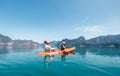 Father and son together paddling in kayak on the Cheow Lan lake in Thailand. Vacation with kids concept image Royalty Free Stock Photo