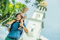 Father and son of tourists in the background of Queen Victoria Memorial clock tower, Penang Royalty Free Stock Photo