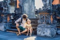 Father and son tourists on the background of Tanah Lot - Temple Royalty Free Stock Photo