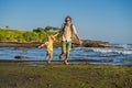 Father and son tourists on the background of Tanah Lot - Temple Royalty Free Stock Photo