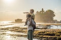 Father and son tourists on the background of Tanah Lot - Temple Royalty Free Stock Photo