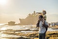 Father and son tourists on the background of Tanah Lot - Temple Royalty Free Stock Photo