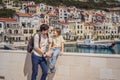 Father and son tourists enjoying the views of Architecture and luxury yachts in Lustica Bay, Montenegro. Travel around