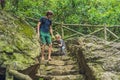 Father and son tourists go down the stairs. haiking Royalty Free Stock Photo