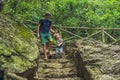 Father and son tourists go down the stairs. haiking Royalty Free Stock Photo