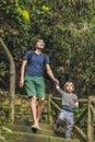 Father and son tourists go down the stairs. haiking Royalty Free Stock Photo