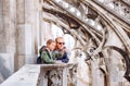 Father with son tourists are on the roof of Milan Cathedral