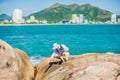 Father and son travelers at the Hon Chong cape, Garden stone, popular tourist destinations at Nha Trang. Vietnam