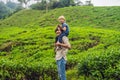 Father and son are traveling on a tea plantation in Malaysia. Tr Royalty Free Stock Photo