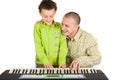 Father and son trying to play piano Royalty Free Stock Photo