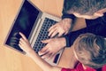 Father and son using computer together Royalty Free Stock Photo