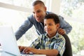 Father And Son Using Laptop At Home Royalty Free Stock Photo