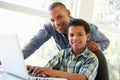 Father And Son Using Laptop At Home Royalty Free Stock Photo