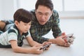 Father son in using the smartphone together for modern family and parenting concept Royalty Free Stock Photo