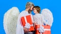 Father and son Valentines angels with presents. Happy man and child Valentine cupid with gift box. Royalty Free Stock Photo