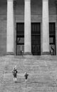 Black and white image of people walking up the steps of the Washington State Capitol building Royalty Free Stock Photo