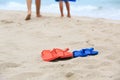 Father and son walking at beach, flip flops on sand Royalty Free Stock Photo