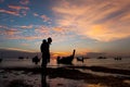 Father and son walking and play at beach sunset background