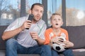 Father and son watching soccer match Royalty Free Stock Photo