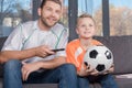 Father and son watching soccer match Royalty Free Stock Photo