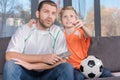 Father and son watching soccer match Royalty Free Stock Photo
