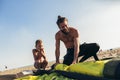 Father and son in wetsuits with kite equipment for surfing Royalty Free Stock Photo