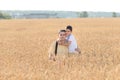 Father and son are in the wheat field. Ukrainian family. Father`s day. Boy with father. Day of Independence