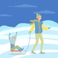 Father and son on a winter walk. Man sledding a happy boy. Family members walking together Royalty Free Stock Photo